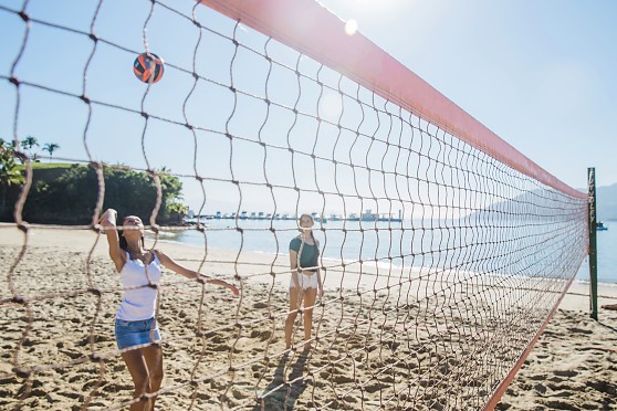 young-girls-playing-volley-beach.jpg
